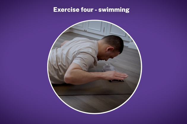 close up of someone performing the Pilates swimming exercise, with they chest lifted slightly off the mat and their arms moving towards their shoulder blades