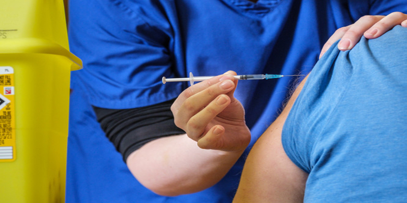 Person receiving vaccination