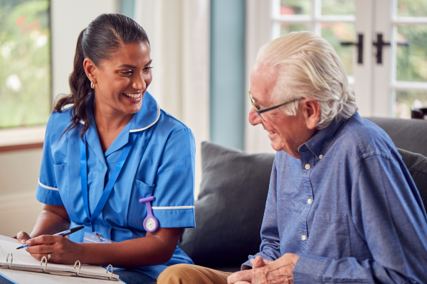 Picture of nurse smiling at older patient