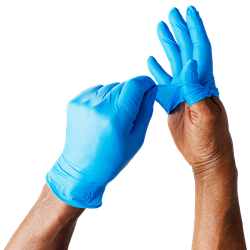 2 hands with gloves being taken off