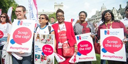 Image of nurses holding 'scrap the cap' campaign placards