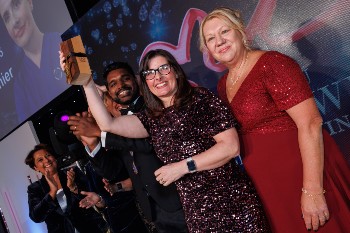 Sponsor-page-signpost-Annie-on-stage-NOTY-2025